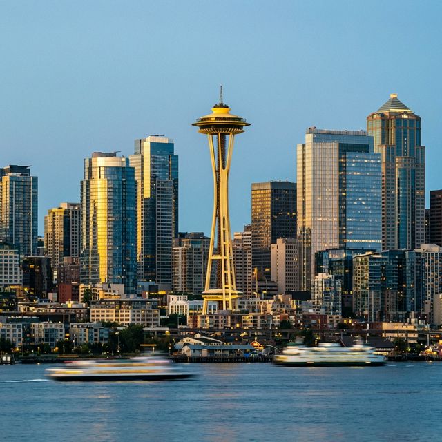 Seattle skyline at dusk with the Space Needle and modern skyscrapers, representing the fast-paced Pacific Northwest tech landscape.